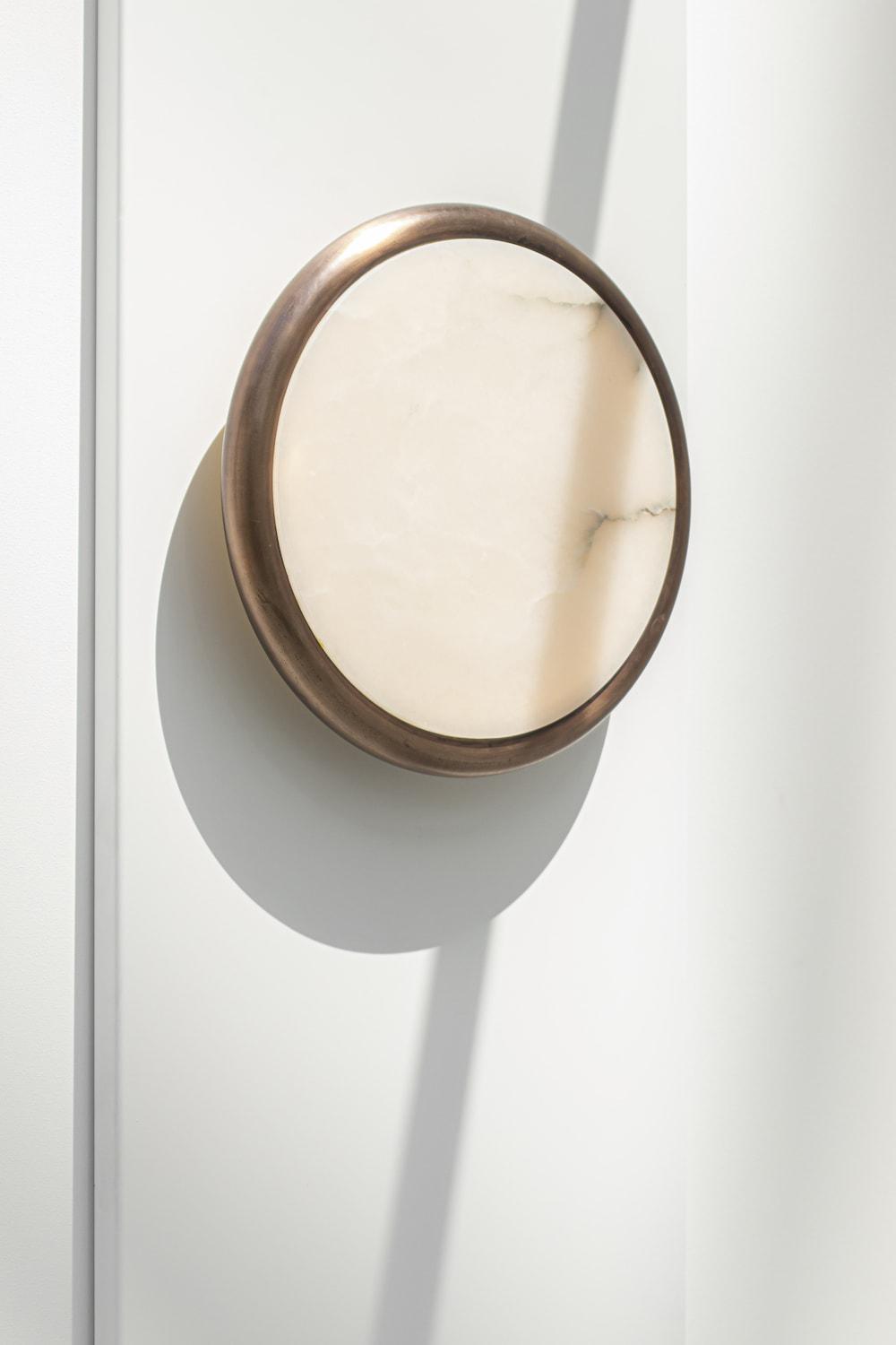 Moon alabaster wall sconce by Bling Lighting Studio
